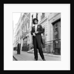 Phil Lynott in London, modelling clothes from Saville Row. 1983 by Mike Maloney