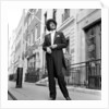 Phil Lynott in London, modelling clothes from Saville Row. 1983 by Mike Maloney