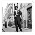 Phil Lynott in London, modelling clothes from Saville Row. 1983 by Mike Maloney