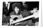 Phil Lynott of Thin Lizzy during a recording session for the groups new album. by Andy Hosie