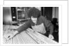 Phil Lynott of Thin Lizzy during a recording session for the groups new album. by Andy Hosie