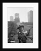 Young boy playing cowboys in Collyhurst by Dennis Hussey