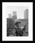 Young boy playing cowboys in Collyhurst by Dennis Hussey