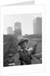 Young boy playing cowboys in Collyhurst by Dennis Hussey
