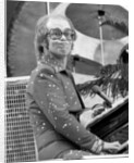 Elton John performing on stage at Wembley Stadium., London, England in June 1975 by Chris Barham