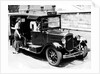 A female passenger entering one of the new London taxi cabs by Staff