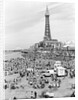 Blackpool Tower with people sitting on Blackpool Beach by Anonymous