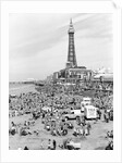 Blackpool Tower with people sitting on Blackpool Beach by Anonymous