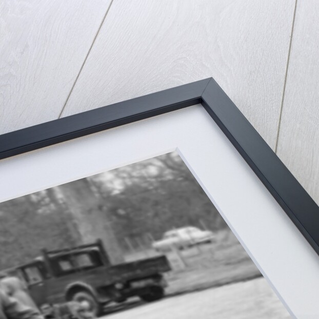 Lord Brabazon in the driver's seat of a vintage car, 1956 by Unknown