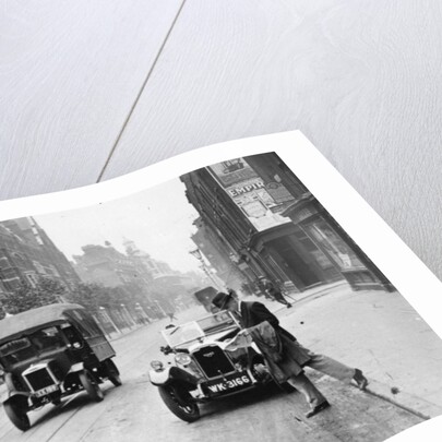 A Rover 1928 10/25 HP sports car parked in a London street, 1931 by Unknown