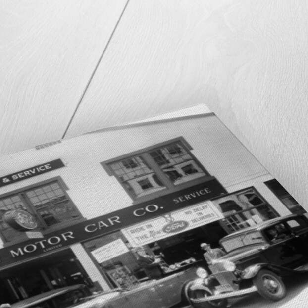 1932 Ford V8 in front of a car showroom, (c1932?) by Unknown