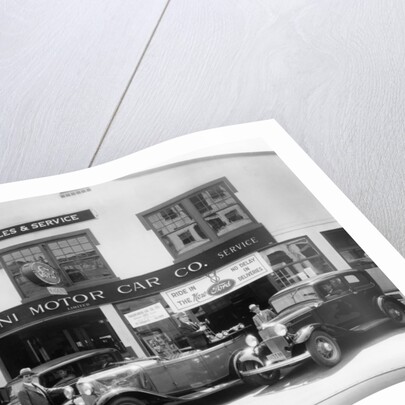 1932 Ford V8 in front of a car showroom, (c1932?) by Unknown