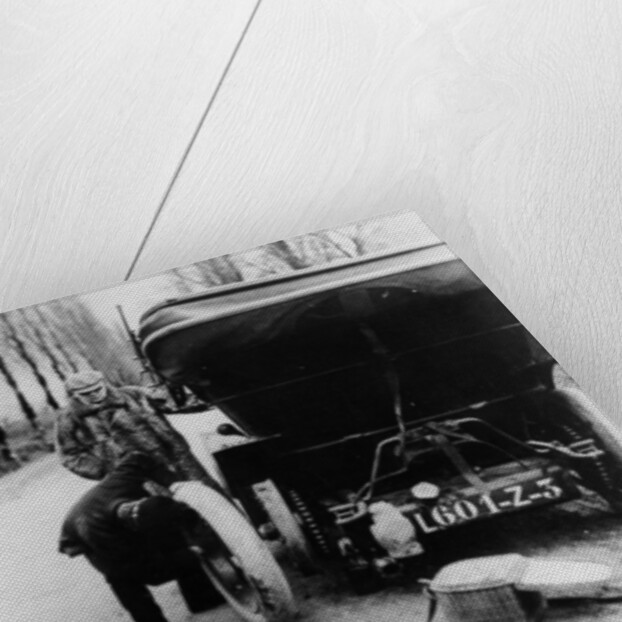Lord Northcliffe's chauffeur changing a tyre, (c1908?) by Unknown
