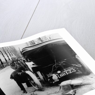 Lord Northcliffe's chauffeur changing a tyre, (c1908?) by Unknown