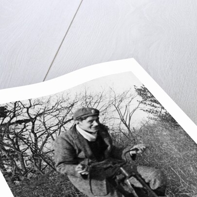 A young Lord Nuffield riding a bicycle down a country lane by Unknown