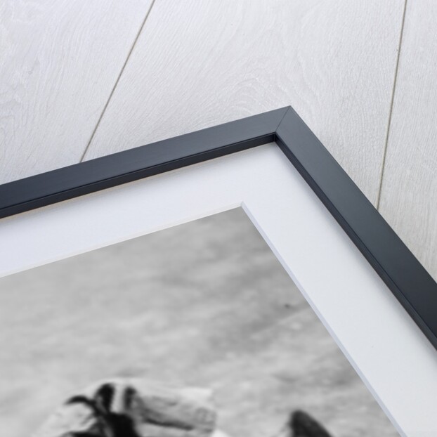 Michael Ware repairing his pedal car by Unknown