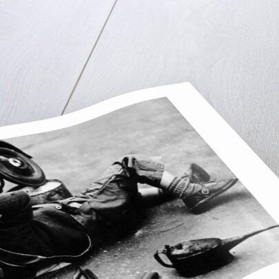 Michael Ware repairing his pedal car by Unknown