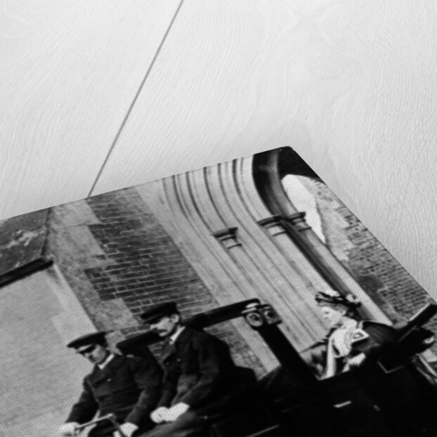 Two chauffeurs driving a convertible City and Suburban electric car by Unknown