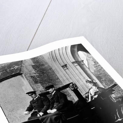 Two chauffeurs driving a convertible City and Suburban electric car by Unknown