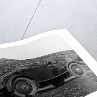 A woman picnicking next to her air-cooled Rover 8, c1919-c1925 by Unknown