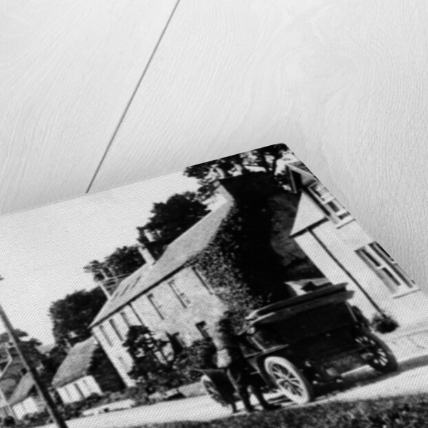 A man by his car in a village lane, 1900 by Unknown