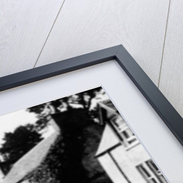 A man by his car in a village lane, 1900 by Unknown