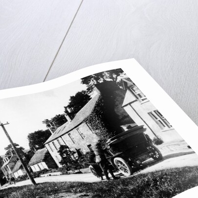 A man by his car in a village lane, 1900 by Unknown