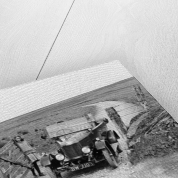 A Morris Bullnose driving through a gateway, early 1920s by Unknown