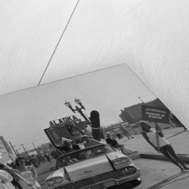 Models and a Cadillac on a parade, USA, (c1959?) by Unknown