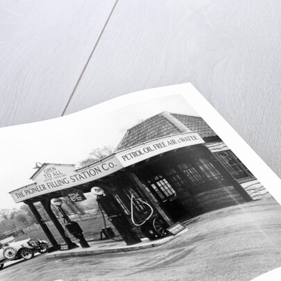 1923 10 hp Calcott arriving at a petrol station by Anonymous