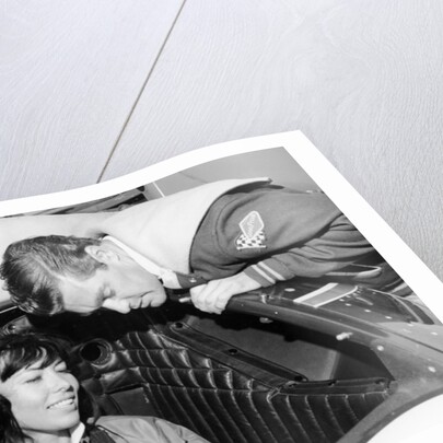 Craig Breedlove explaining the controls of 'Spirit of America Sonic I' to his wife, Lee, c1965 by Unknown