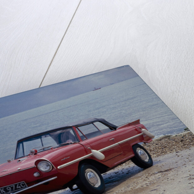 A 1965 Amphicar at the water's edge by Unknown