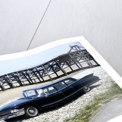 A 1961 Cadillac Presidential limousine on a beach by Unknown