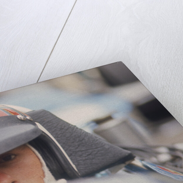 Jackie Stewart at the wheel of a racing car by Unknown