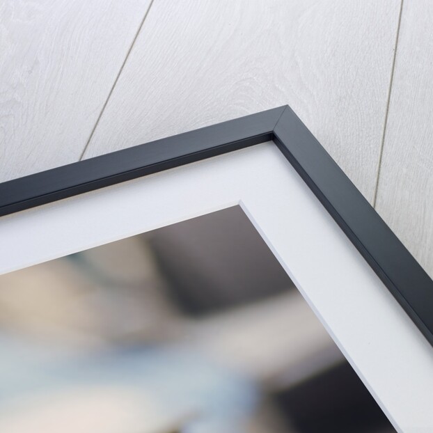 Jackie Stewart at the wheel of a racing car by Unknown