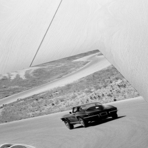 1964 Chevrolet Corvette Stingray on a winding racetrack, (c1964?) by Unknown