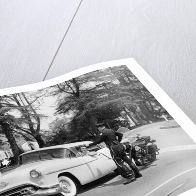 An Oldsmobile at the corner of an American street, 1954 by Unknown