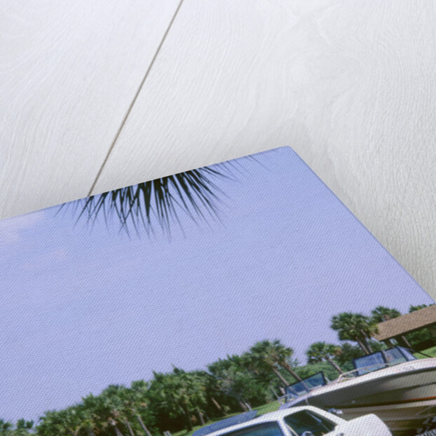 1967 Ford Mustang towing a boat by Unknown