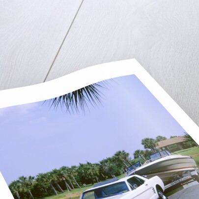 1967 Ford Mustang towing a boat by Unknown