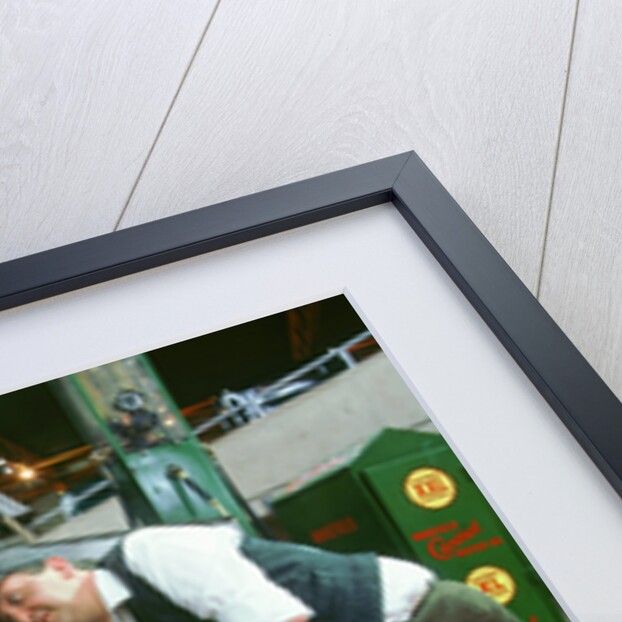 Mechanic with lady driver doing her make up, 1930's Hillman Minx by Unknown