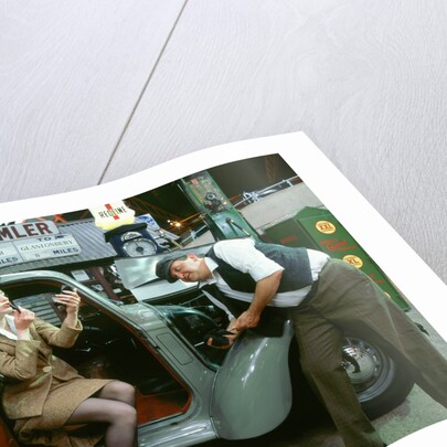 Mechanic with lady driver doing her make up, 1930's Hillman Minx by Unknown
