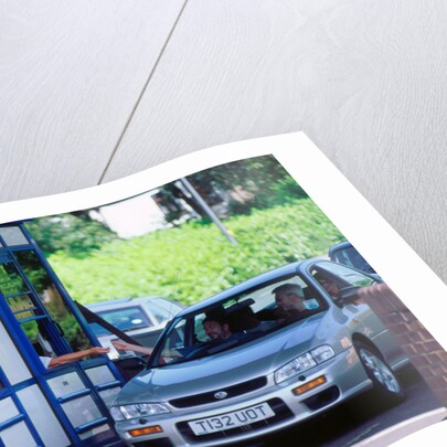 Subaru using toll booth on Itchen bridge, Southampton by Unknown