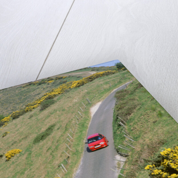 1996 Suzuki Baleno GS Sport on winding country lane,Dorset by Unknown