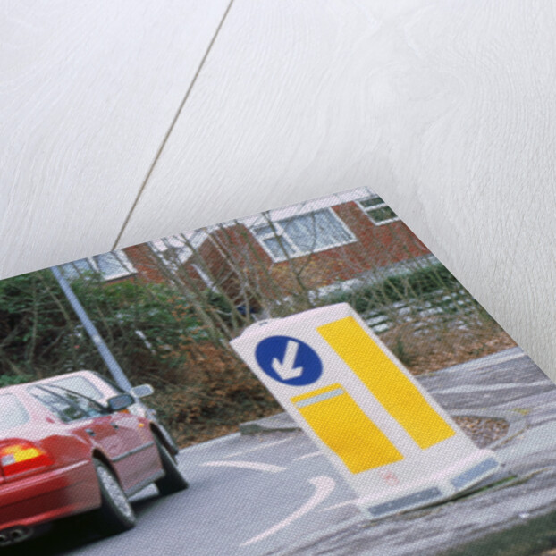 Keep left bollard.Road junction by Unknown