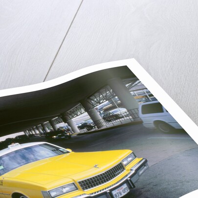 Yellow taxi cab at airport by Unknown