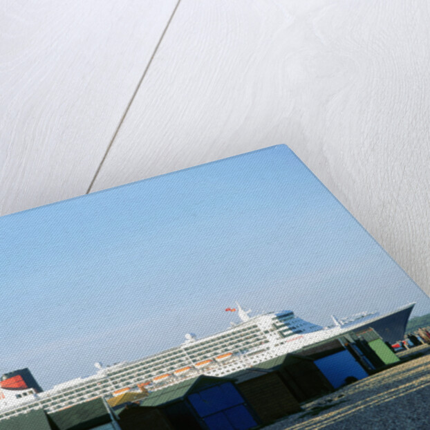 Queen Mary II sails past Beach Huts, Calshot May 2004 by Unknown