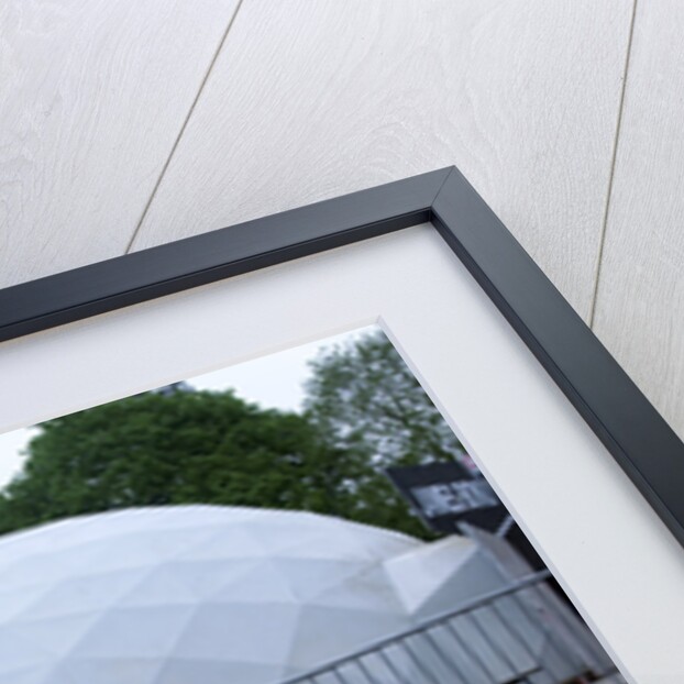 Child driving a toy Land Rover by Unknown