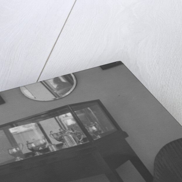 Cabinet containing motor racing trophies by Bill Brunell