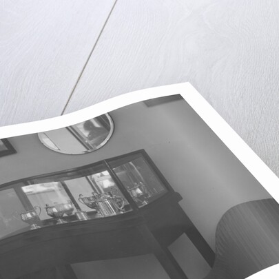 Cabinet containing motor racing trophies by Bill Brunell