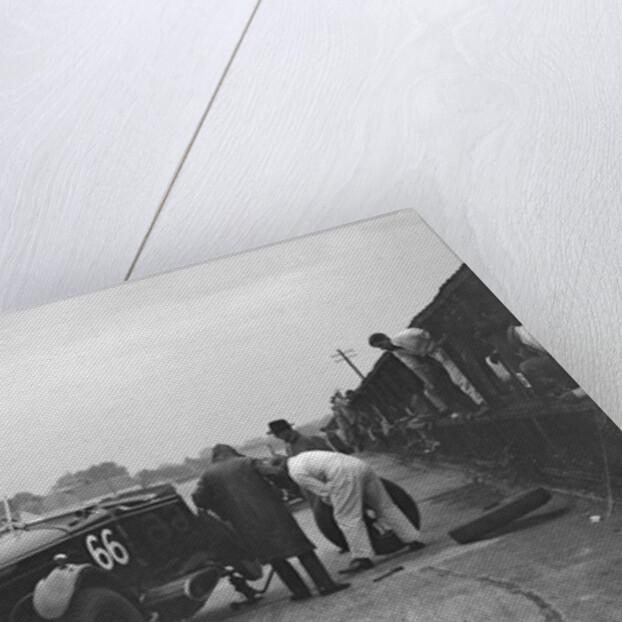 GL Baker's 5954 cc Minerva undergoing a rear wheel change at Brooklands by Bill Brunell